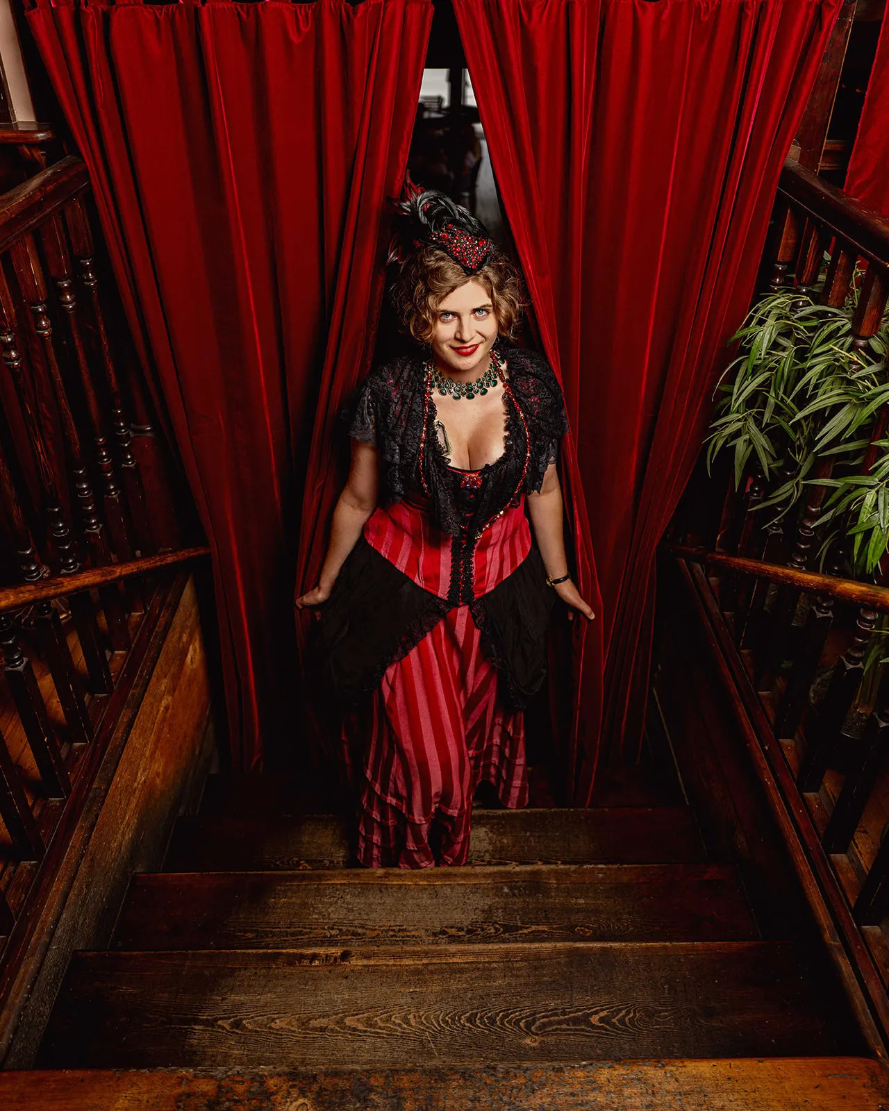 Madam ascending the historic staircase